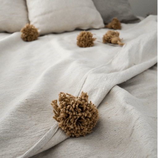 Pompondeken creme en beige